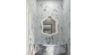 blue and white bathroom with sink and mirror