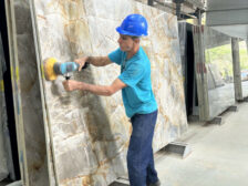 Worker at Slab in Brazilian Stone Production Facility